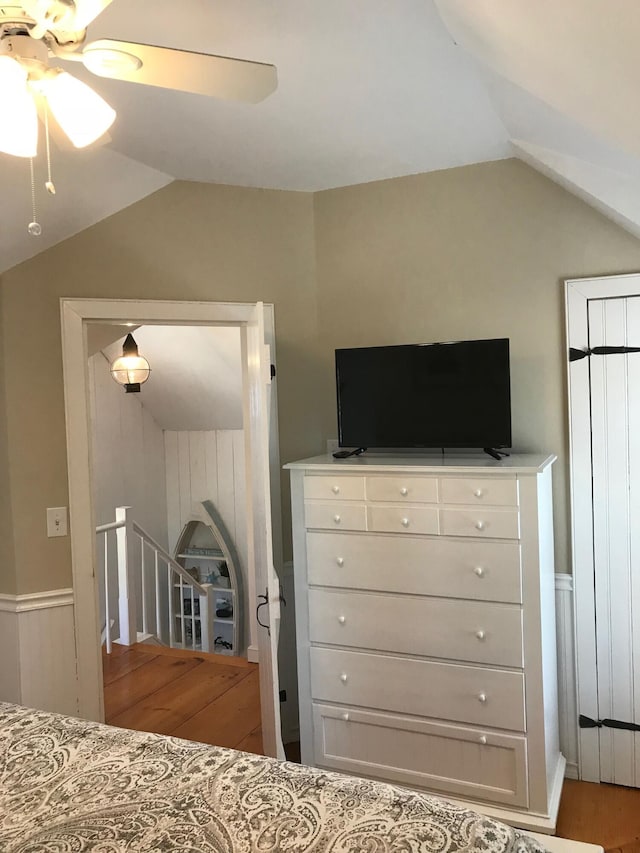 5 Milestone Way, Mashpee, MA 02649 - unfurnished bedroom with wood finished floors, ceiling fan, vaulted ceiling, and wainscoting