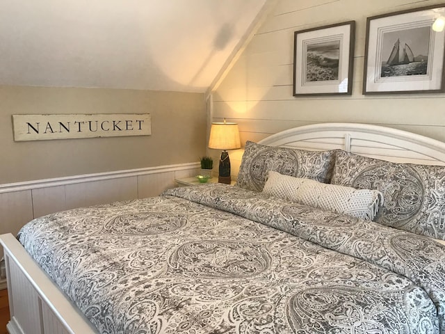 5 Milestone Way, Mashpee, MA 02649 - bedroom featuring vaulted ceiling, wooden walls, and wainscoting