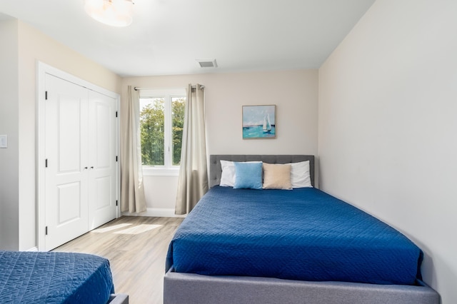 218 Center St, South Dennis, MA 02660 - bedroom with wood finished floors and a closet
