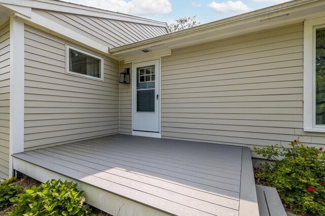 218 Center St, South Dennis, MA 02660 - kitchen with appliances with stainless steel finishes, recessed lighting, a center island, white cabinetry, and a sink