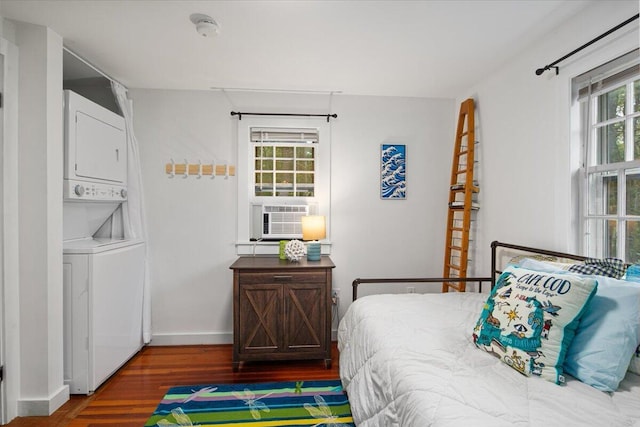 18 Boulder Rd, Brewster, MA 02631 - bedroom with stacked washer / drying machine, cooling unit, wood finished floors, and baseboards