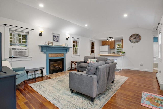 18 Boulder Rd, Brewster, MA 02631 - living area featuring a baseboard radiator, cooling unit, healthy amount of natural light, vaulted ceiling, and recessed lighting
