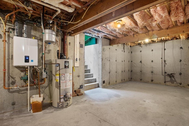 18 Boulder Rd, Brewster, MA 02631 - unfinished basement featuring gas water heater, stairs, and water heater