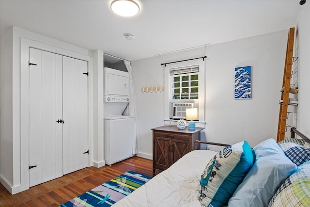 18 Boulder Rd, Brewster, MA 02631 - bedroom with stacked washer / dryer, wood finished floors, cooling unit, a closet, and baseboards