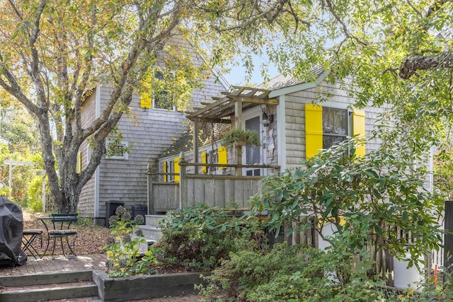 view of home's exterior featuring a pergola