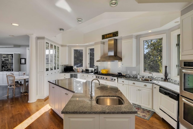 169 Daniels Island Rd, Mashpee, MA 02649 - kitchen with wall chimney exhaust hood, appliances with stainless steel finishes, a sink, and a kitchen island with sink