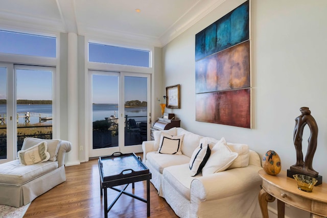 169 Daniels Island Rd, Mashpee, MA 02649 - living room featuring wood finished floors, a water view, and crown molding