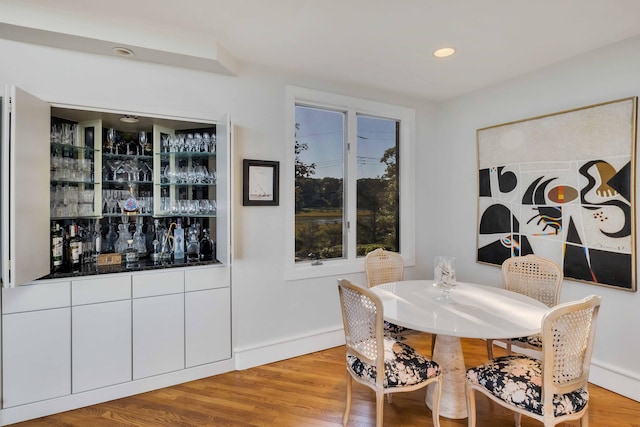 169 Daniels Island Rd, Mashpee, MA 02649 - dining room with recessed lighting, a bar, and light wood-type flooring