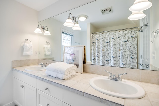 full bathroom with double vanity and curtained shower