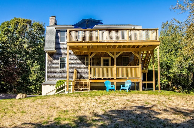 back of property with a wooden deck