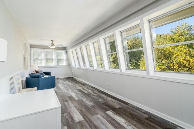 sunroom / solarium featuring ceiling fan