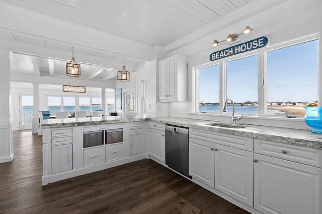kitchen featuring a sink, a peninsula, stainless steel dishwasher, beamed ceiling, and white cabinets
