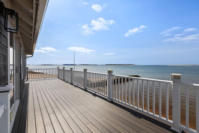 wooden terrace with a water view