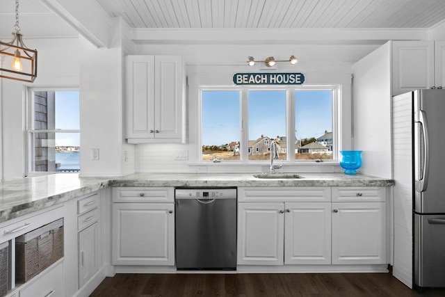 kitchen with white cabinetry, a sink, and appliances with stainless steel finishes