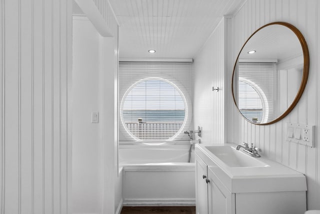full bath featuring a bath and vanity