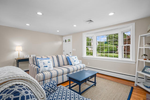 69 Joan Rd, Centerville, MA 02632 - living room featuring wood finished floors, recessed lighting, and a baseboard radiator