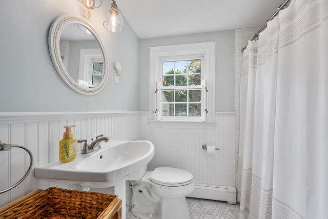 69 Joan Rd, Centerville, MA 02632 - bathroom featuring a baseboard radiator, wainscoting, tile patterned flooring, and a shower with shower curtain