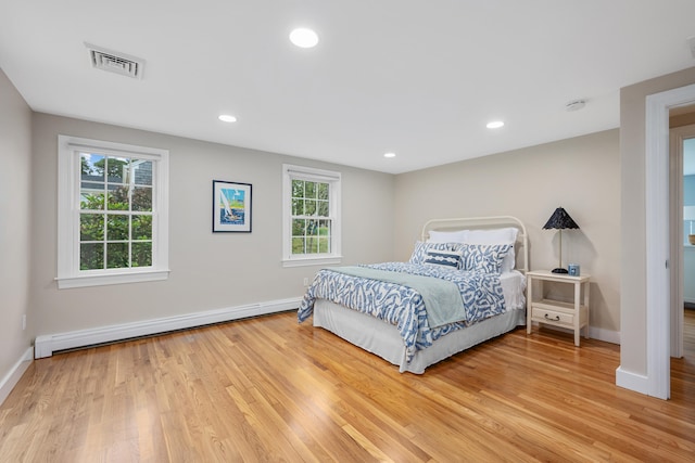 69 Joan Rd, Centerville, MA 02632 - bedroom with baseboard heating, light wood-style floors, and recessed lighting