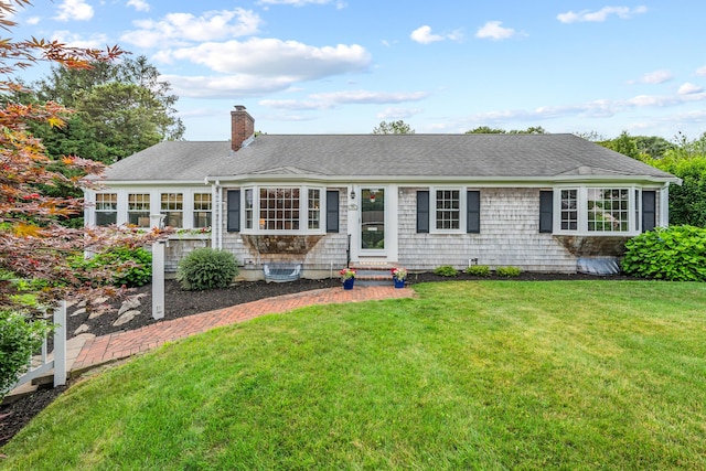 69 Joan Rd, Centerville, MA 02632 - ranch-style house featuring entry steps, a chimney, a front yard, and roof with shingles