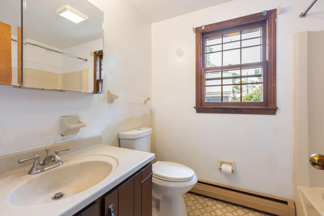 bathroom with a baseboard heating unit, toilet, tile patterned floors, and vanity