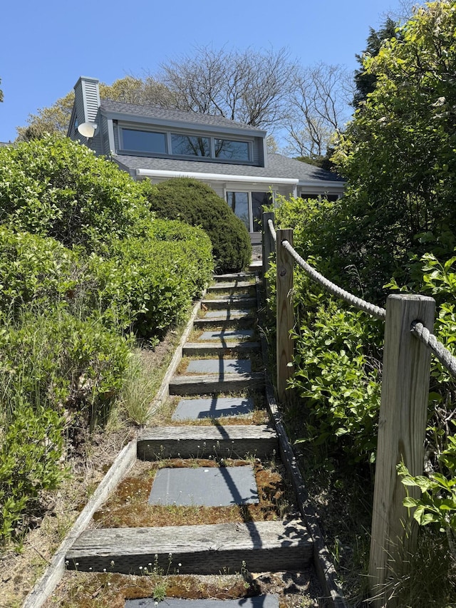 15 Hidden Valley Way, Wellfleet, MA 02667 - view of front of property featuring roof with shingles and a chimney