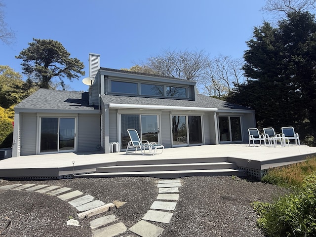 15 Hidden Valley Way, Wellfleet, MA 02667 - back of house with roof with shingles, a chimney, and a deck