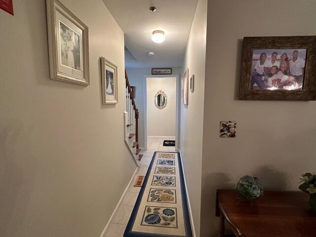 hallway with tile patterned floors