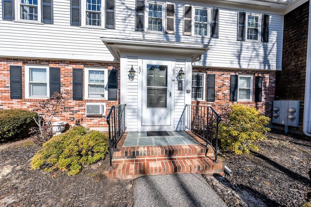 entrance to property with brick siding