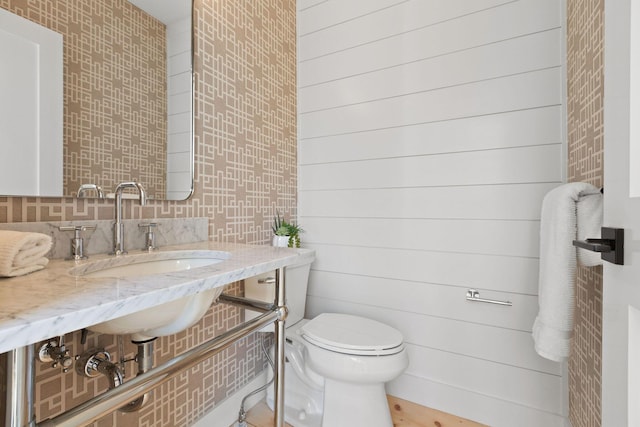 540 S Orleans Rd, Orleans, MA 02653 - bathroom with a sink, toilet, and backsplash