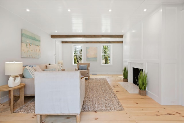 540 S Orleans Rd, Orleans, MA 02653 - living room with light wood finished floors, recessed lighting, beam ceiling, and a fireplace