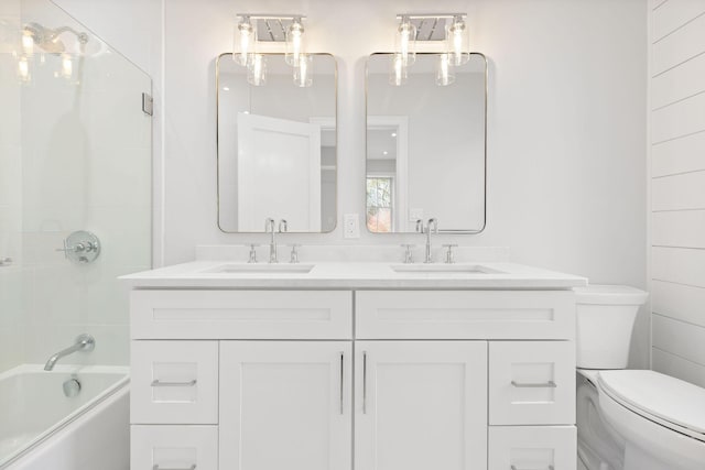 540 S Orleans Rd, Orleans, MA 02653 - full bath featuring toilet, double vanity, and shower / bathtub combination