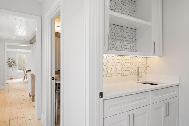 540 S Orleans Rd, Orleans, MA 02653 - bar area featuring a sink, light wood finished floors, recessed lighting, and tasteful backsplash