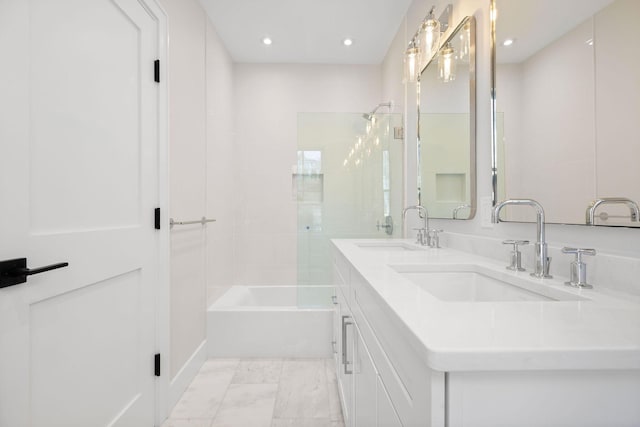 540 S Orleans Rd, Orleans, MA 02653 - bathroom with recessed lighting, double vanity, marble look tiles, and shower / tub combination