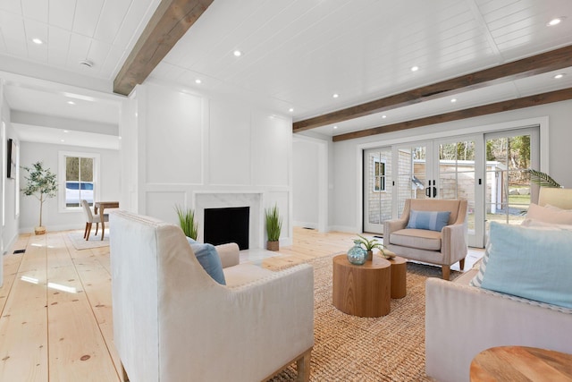 540 S Orleans Rd, Orleans, MA 02653 - living area featuring beam ceiling, light wood finished floors, healthy amount of natural light, recessed lighting, and a premium fireplace