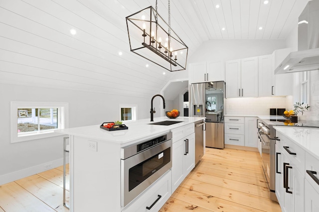 540 S Orleans Rd, Orleans, MA 02653 - kitchen with a sink, appliances with stainless steel finishes, vaulted ceiling, wall chimney range hood, and wood ceiling