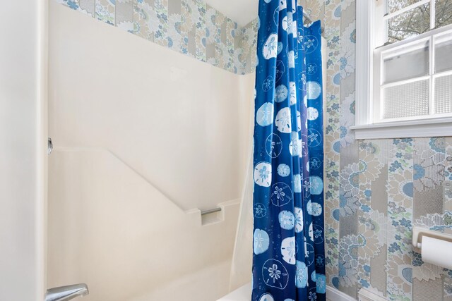bathroom with a shower with shower curtain
