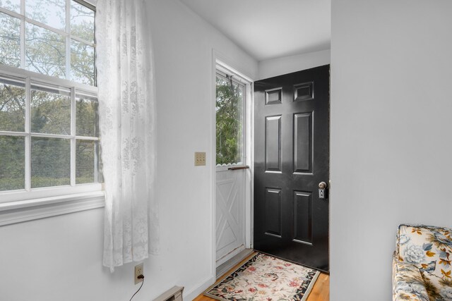 doorway to outside featuring wood finished floors