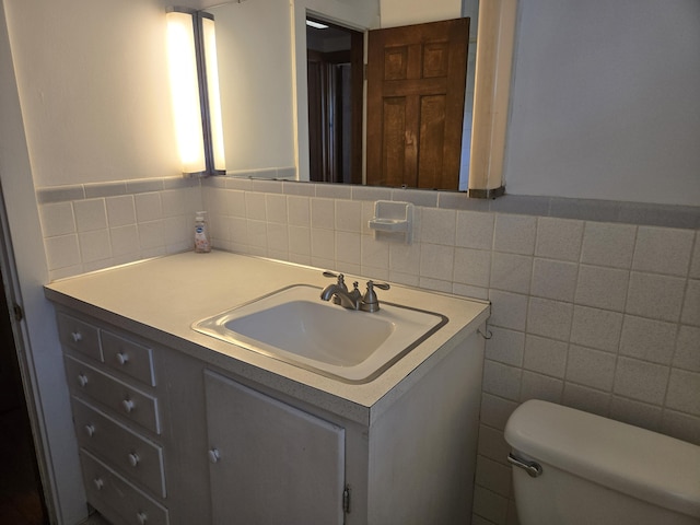 22 Cypress St, East Falmouth, MA 02536 - bathroom with vanity, toilet, and tile walls
