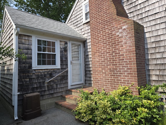 22 Cypress St, East Falmouth, MA 02536 - entrance to property with roof with shingles