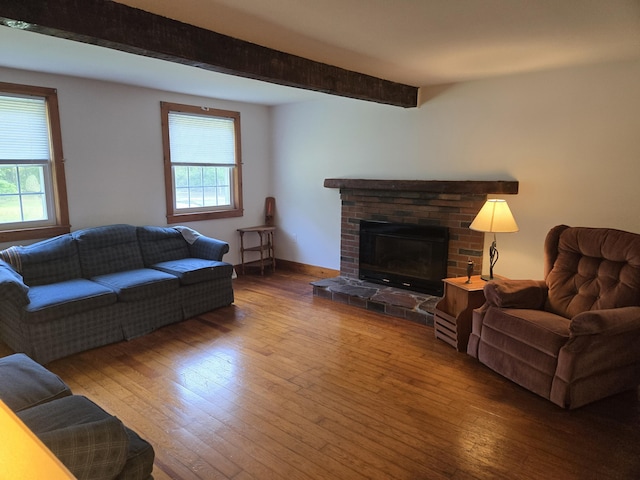22 Cypress St, East Falmouth, MA 02536 - living area featuring wood-type flooring, beamed ceiling, and a fireplace