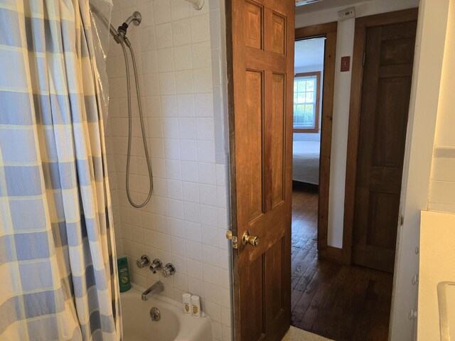 22 Cypress St, East Falmouth, MA 02536 - full bathroom featuring shower / bath combo with shower curtain and wood-type flooring
