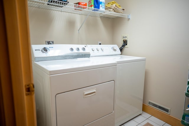 47 Stoney Pond Cir, Marstons Mills, MA 02648 - clothes washing area with separate washer and dryer and light tile patterned floors