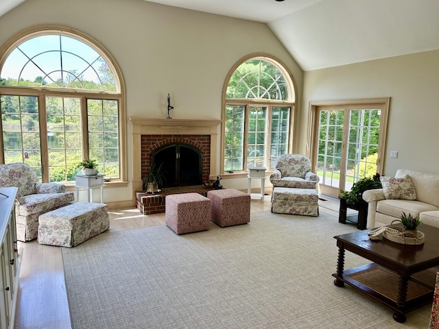 47 Stoney Pond Cir, Marstons Mills, MA 02648 - living area featuring wood finished floors, high vaulted ceiling, and a fireplace