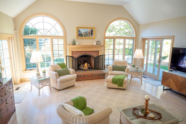 47 Stoney Pond Cir, Marstons Mills, MA 02648 - living room featuring wood finished floors, a brick fireplace, and high vaulted ceiling