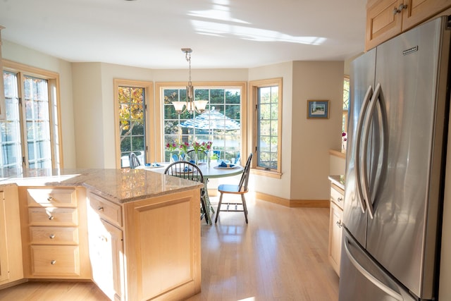 47 Stoney Pond Cir, Marstons Mills, MA 02648 - kitchen with freestanding refrigerator, light wood-style floors, a chandelier, light brown cabinetry, and baseboards