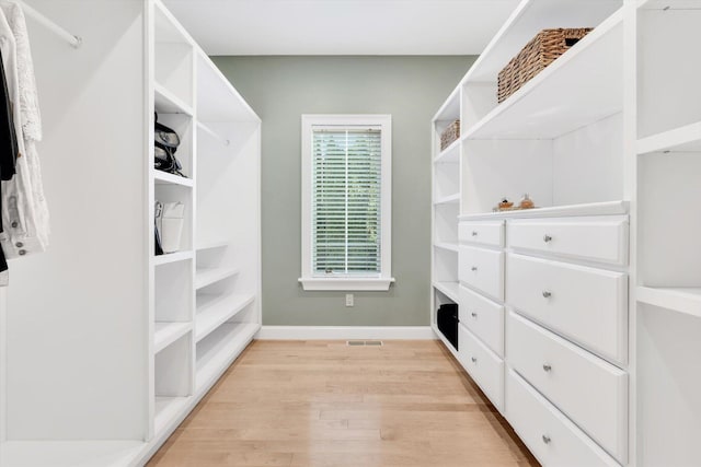 spacious closet featuring light wood finished floors and visible vents