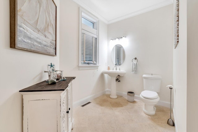 bathroom with ornamental molding, baseboards, visible vents, and toilet