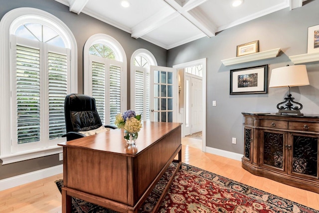 office area featuring light wood-type flooring, baseboards, coffered ceiling, and beam ceiling