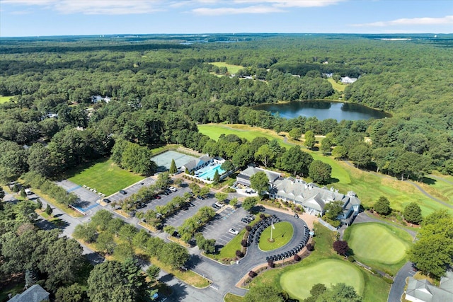 aerial view featuring a water view, view of golf course, and a view of trees