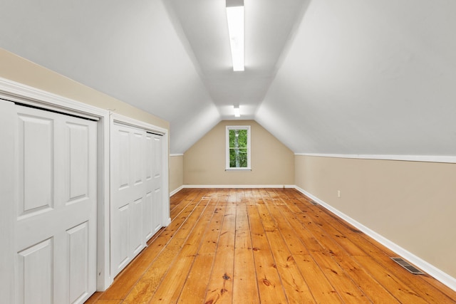 29 Windward Walk, Harwich Port, MA 02646 - bonus room with light wood-type flooring, vaulted ceiling, and baseboards